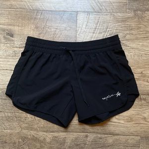 RayaSun black athletic shorts.